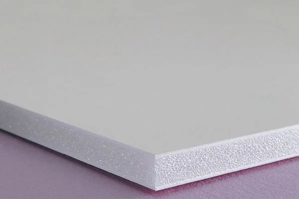 A corner of gatorboard: a rigid high-density foam core between smooth white facings